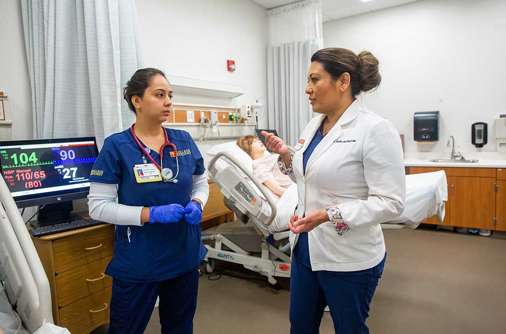 Faculty members lead a healthcare simulation